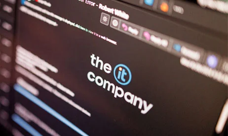 The IT Company logo displayed on a monitor