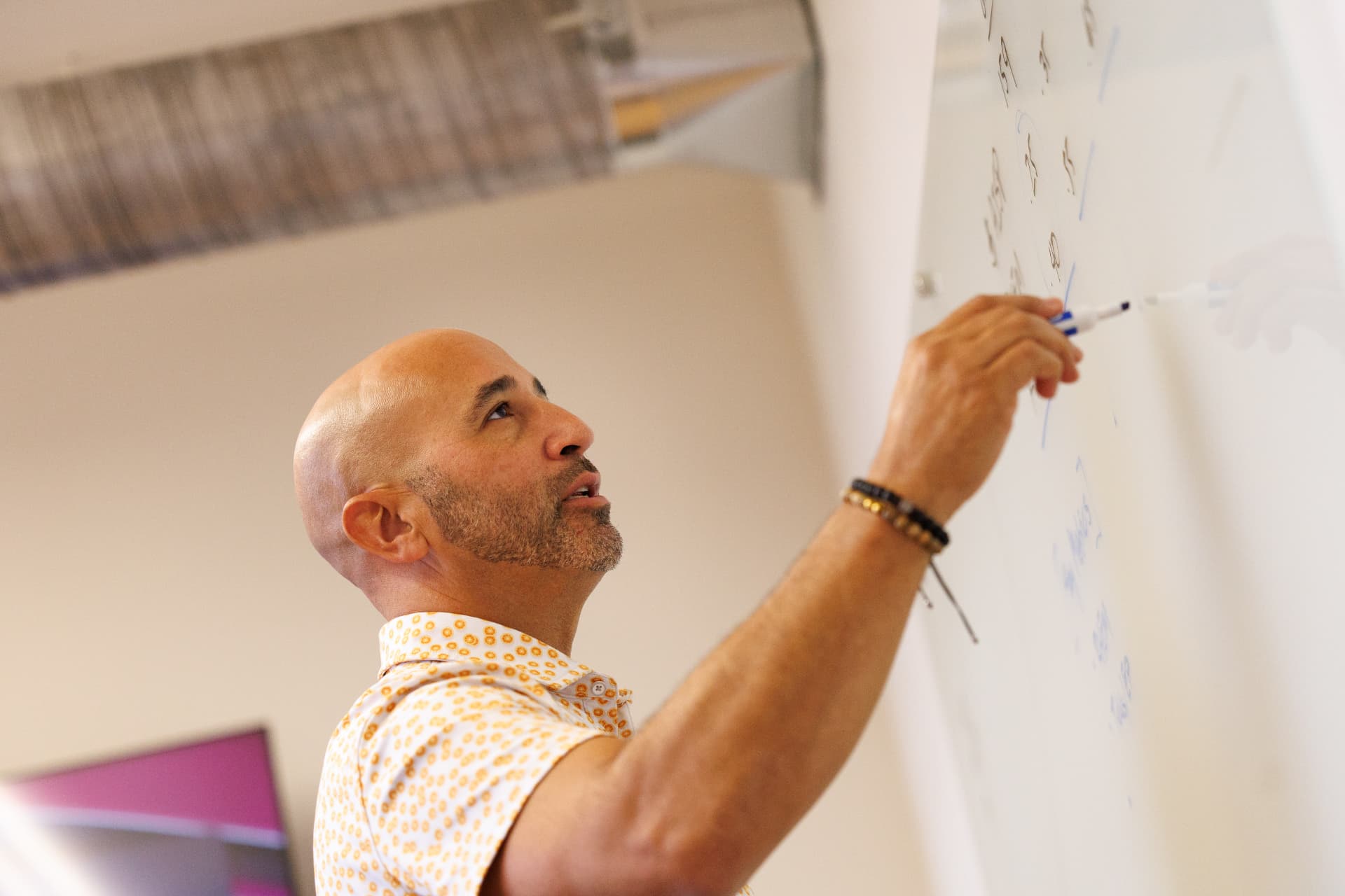 IT strategist mapping a technology roadmap on a whiteboard